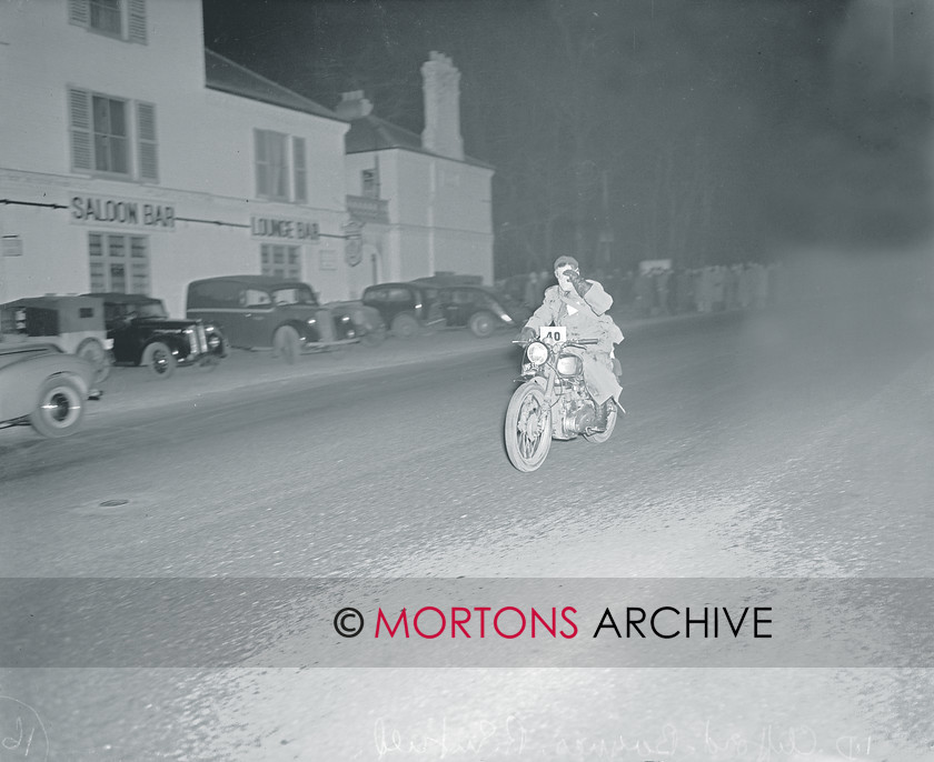 straight from plate 16 
 A jaunty wave from ID Clifford-Baynes, on his Royal Enfield 
 Keywords: 1950 Exeter Trial, Action, Mortons Archive, Mortons Media Group, Straight from the plate, The Classic MotorCycle