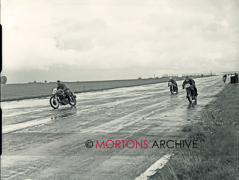 SFTP 1954 Hutchinson 100 06 
 1954 Hutchinson 100 held at a wet Silverstone - John Clark (AJS) gets away on the outside, R E D Howison and Bob Mac give chase. 
 Keywords: 2016, April, Glass plate, Hutchison, Mortons Archive, Mortons Media Group Ltd, Straight from the plate, The Classic MotorCycle