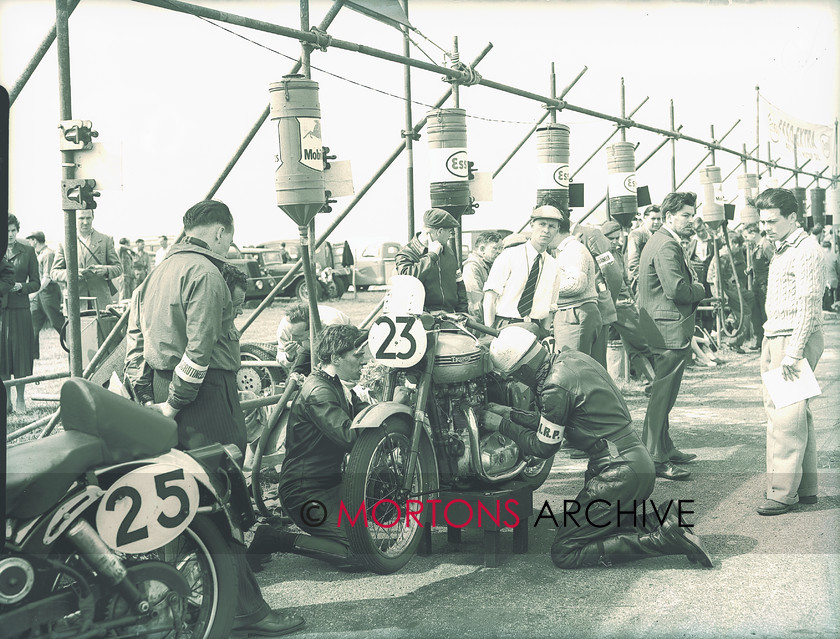 plate 1728 24 
 Frantic pit work on the Dickenson/Tyack Tiger 100. 
 Keywords: 1956, July 2011, Mortons Archive, Mortons Media Group, Straight from the plate, The Classic MotorCycle, Thruxton