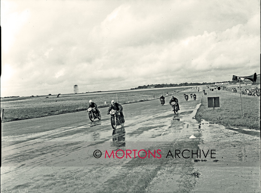 SFTP 1954 Hutchinson 100 04 
 1954 Hutchinson 100 held at a wet Silverstone - the riders were met with less idel conditions throughout the duration od the Hutchinson 100. 
 Keywords: 2016, April, Glass plate, Hutchison, Mortons Archive, Mortons Media Group Ltd, Straight from the plate, The Classic MotorCycle