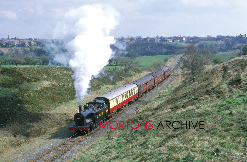 WD594786@64 preservation 00 
 Early days on the East Lancashire Railway, LMS Jinty 01-6-0T No 7298 passes Burrs on 9th April 1989. 
 Keywords: Heritage Railway, Mortons Archive, Mortons Media Group