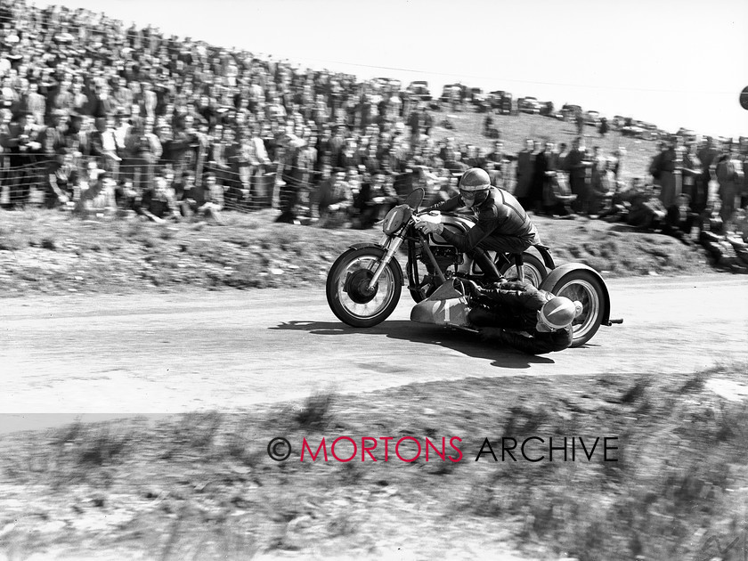 15198-20 
 Eppynt Road Race 1953. Double winner and imperious in the sidecar class, Pip Harris. 
 Keywords: 15198-20, 1953, April 2010, eppynt road race, glass plate, may, norton, racing, road, road race, sidecar, Straight from the plate, tcm, The Classic Motorcycle, unit