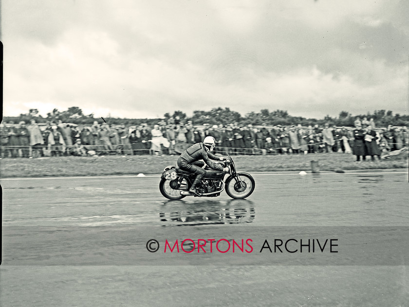 SFTP 1954 Hutchinson 100 05 
 1954 Hutchinson 100 held at a wet Silverstone - Cecil Sandford in full flight on his 350cc Velocette 
 Keywords: 2016, April, Glass plate, Hutchison, Mortons Archive, Mortons Media Group Ltd, Straight from the plate, The Classic MotorCycle