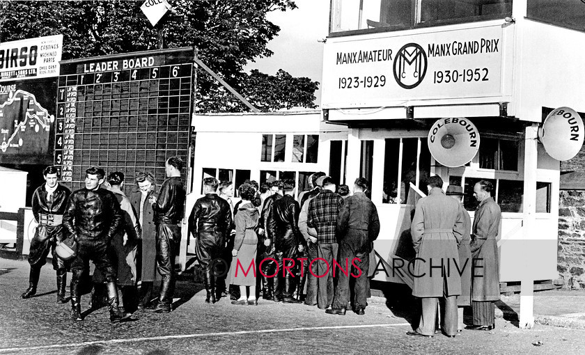 Manx 22C 
 22C – Anxious competitors at the 1952 Manx Grand Prix wait to check their practice times. 
 Keywords: 2012, Exhibition of historic images, Manx Grand Prix, Mortons Archive, Mortons Media Group, Mountain Milestones - Memories from Mona's Isle