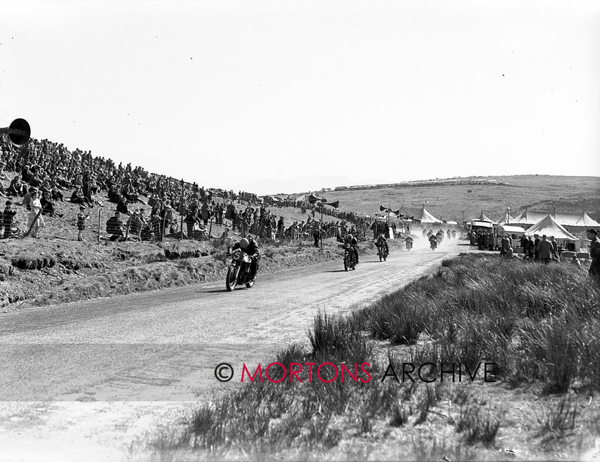 15198-2 
 Eppynt Road Race 1953. Sid Barnett was on form, but chucked away a 350cc win when he crashed. He took a 500cc victory though. 
 Keywords: 15198-2, 1953, April 2010, eppynt road race, glass plate, may, race 5 start, racing, road, road race, Straight from the plate, tcm, The Classic Motorcycle