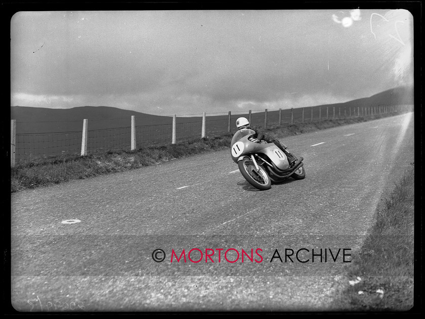 20099-03 
 1960 Senior TT. The brilliant John Surtees. The 26-year-old MV-riding Londoner pulverised the field and averaged over 102mph for the 226-and-a-half miles. 
 Keywords: glass plate, isle of man, Mortons Archive, Mortons Media Group Ltd, Straight from the plate, the classic motorcycle
