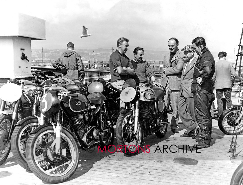 Manx 6A new 
 Page 6 A- Reliving the 1960 MGP on the ferry home are, left to right, Fred Neville, Dennis Dicker, Jack Holloway, Malcolm Challis and Dick Carmen. 
 Keywords: 2012, Exhibition of historic images, Manx Grand Prix, Mortons Archive, Mortons Media Group, Mountain Milestones - Memories from Mona's Isle