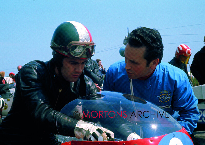 Agostini-041 
 From the Nick Nicholls Collection - Vittorio Carvana the mechanic behind Giacomo Agostini's success, chat here with the champion in 1971.