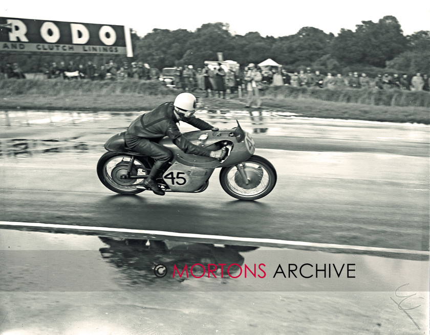 SFTP 1954 Hutchinson 100 08 
 1954 Hutchinson 100 held at a wet Silverstone - Geoff Duke storms to victory on his Gilera 500cc 
 Keywords: 2016, April, Glass plate, Hutchison, Mortons Archive, Mortons Media Group Ltd, Straight from the plate, The Classic MotorCycle