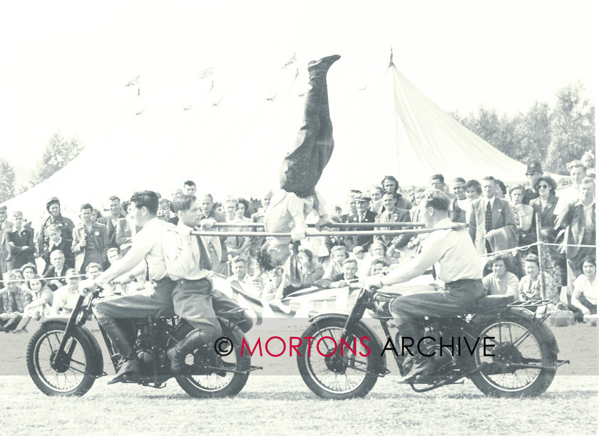 062 SFTP 03 
 Trick riding from the Cytrix display team. Machines are Matchless singles. 
 Keywords: Mar 11, Mortons Archive, Mortons Media Group, Straight from the plate, The 1951 National ACU Rally, The Classic MotorCycle