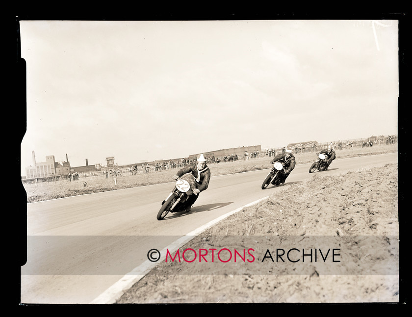 062 Glass Plate 06 
 Aintree road racing September5 1954 - Brooks (BSA), Salt (AJS) and Davey (Norton) in 350cc race action. 
 Keywords: Glass plate, Mortons Archive, Mortons Media Group
