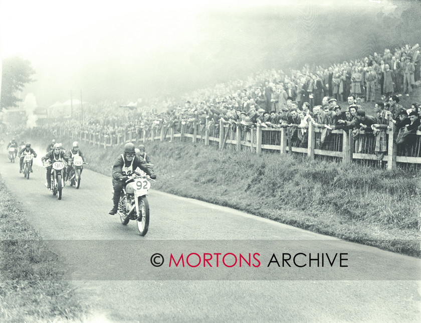 062 SFTP C25670 
 Johnny Hodgkin, aboard the prototype HRD (Vincent) Grey FLash, heads the field. 
 Keywords: 1949, May, Mortons Archive, Mortons Media Group, Oliver's Mount, Scarborough, Straight from the plate, The Classic MotorCycle