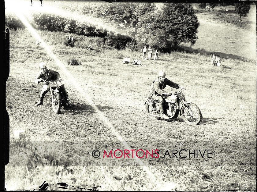 053 SFTP 03 
 Cotswold Scramble, June 1953 - Basil Hall ploughs a neat furrow, while David Tye is all crossed up be-hind. Both on BSAs. 
 Keywords: 2014, Glass plates, June, Mortons Archive, Mortons Media Group Ltd, Scrambling, Straight from the plate, The Classic MotorCycle