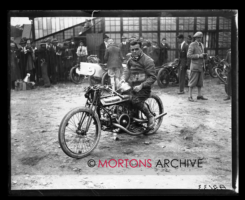 A2133 
 British Motor Cycle Racing Club's 5th monthly meeting, Brooklands 1923. Rex Judd, winner of the 500cc race, poses with his fore-and-aft Douglas. 
 Keywords: 1923, 5th meeting, A2133, bmcrc, brooklands, December 2009, glass plate, Straight from the plate, The Classic Motorcycle
