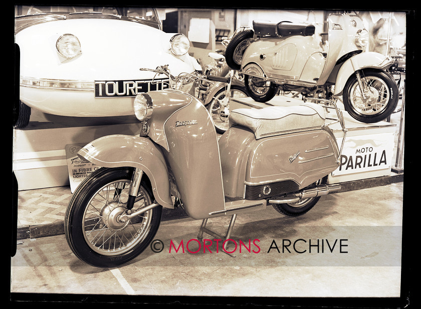 062 GLASS PLATES EARLS CT-8 
 The Earl's Court Show, November 1956 - The Progress scooter was being offered in Britain by the Carr Brothers, drawing heavily on their experience acting as a concessionaire. The engine in the 'Anglian' was by Villers. 
 Keywords: 2013, Earls Court, Glass plate, May, Mortons Archive, Mortons Media Group, Show, Straight from the plate
