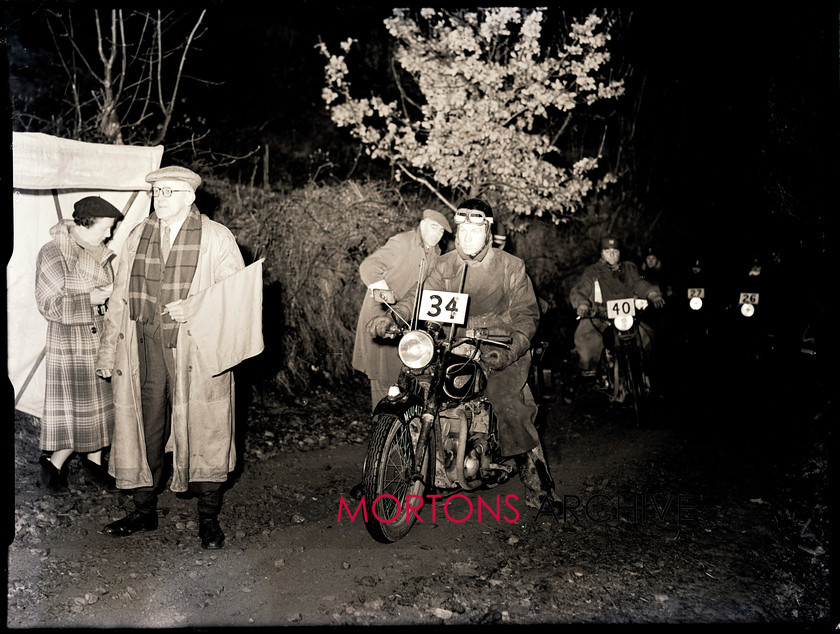 062 lands end 34 15151-28 
 1953 Lands End Trial - J A Barrett prepares to brave the night, on his BSA twin. 
 Keywords: 2013, February, Glass plate, Mortons Archive, Mortons Media Group, Straight from the plate, The Classic MotorCycle, Trials