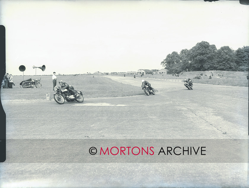 plate 1728 1 
 High-speed Gold Star train - the Orsan/Watson machine leads Eckhart/Smart and James/Lloyd. 
 Keywords: 1956, July 2011, Mortons Archive, Mortons Media Group, Straight from the plate, The Classic MotorCycle, Thruxton