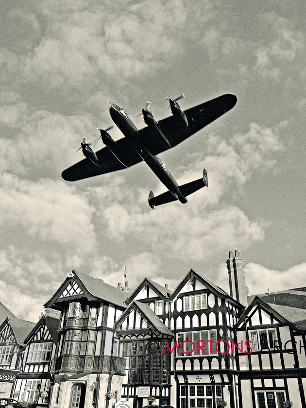 WD525413@62 BC Memorial 2-SEPIA 
 The Lancaster flying over the Petwood Hotell at Woodhall Spa. 
 Keywords: Aviation Classics, feature BC Memorial, issue 1, make Avro, model Lancaster, Mortons Archive, Mortons Media Group, publication Aviation, type I