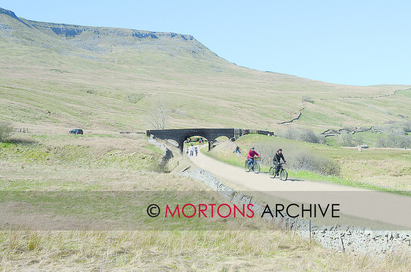 068 Ais Gill 
 What a view at Ais Gill could look like if the line had closed. Two cyclists enjoy the view from the abandoned trackbed where steam locomotives once battled up the 1-in-100 gradient. 
 Keywords: 2014, Heritage Railway, Issue 189, Mortons Archive, Mortons Media Group Ltd