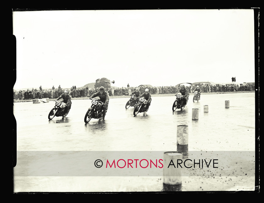 053 SFTP 1951 Thruxton A05 
 Wet day at Thruxton, August 1951 - Start of the big race G W Andrews on his easy-starting Matchless G9 Super Clubman is the unlikely pace setter. 
 Keywords: 2014, April, Glass Plates, Mortons Archive, Mortons Media Group Ltd, Straight from the plate, The Classic MotorCycle, Thruxton