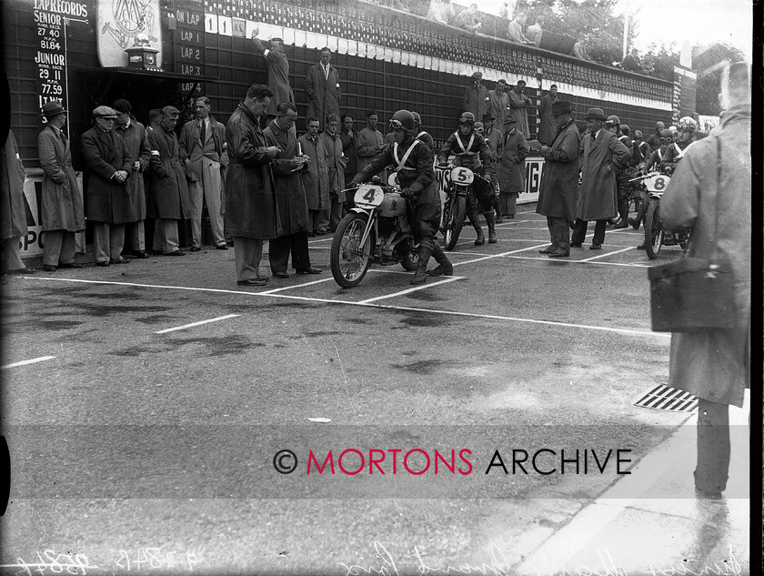 9384-02 
 1936 Junior and Lightweight Manx Grands Prix. Pearson (OK Supreme) prepares to set off. Shaw (5, Excelsior) and Thomson (8, New Imperial) wait behind. 
 Keywords: 1936, 9384-02, glass plate, isle of mann, January 2010, manx, manx junior grand prix, Mortons Archive, Mortons Media, Mortons Media Group Ltd., The Classic MotorCycle, tt