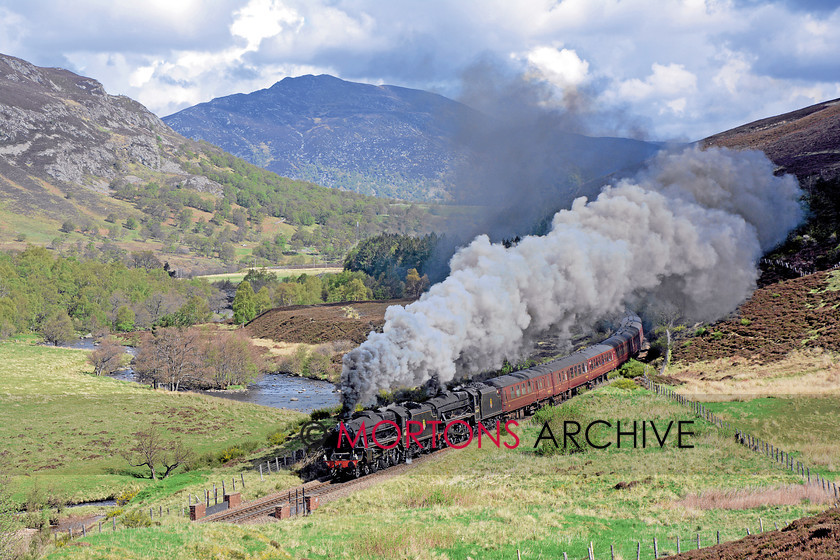 054 45407 Crubenmore 
 Ian Riley's LMS 'Black Five' 4-6-0s Nos 44871 and 45407 head south from Newtomore past Crubenmore on the climb to Drumochter Pass 
 Keywords: 2014, Heritage Railway, Issue 190, Mortons Archive, Mortons Media Group Ltd