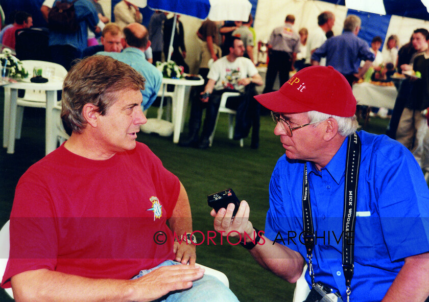 Agostini-046 
 From the Nick Nicholls Collection - Giacomo Agostini chatting to Mick Wollett at Mallory Park 13 June 1999.