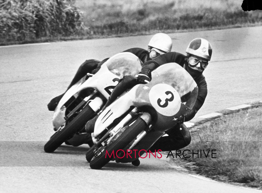 XGB0000030 
 Surprise of the 500cc Race was the appearance of Giacomo Agostini on a new MV Agusta three-cylinder - but here Jim Redman (Honda) has Ago's measure and is ready to pounce. 
 Keywords: Ex GB, Mortons, Mortons Archive, Mortons Media Group