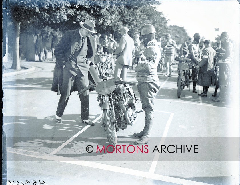 062 Plate 01 
 THe winner of the previous two Amateur TTs, Len Randles, talks to Tory MP, Ralph Hall Caine. 
 Keywords: 1925, Amateur TT, Glass plate, Mortons Archive, Mortons Media Group, Straight from the plate