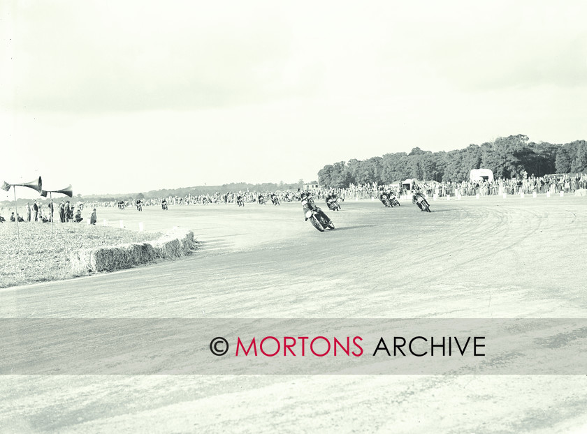 062 SFTP 02 
 1954 Ibsley Airfield racing - John Surtees heads the field. 
 Keywords: 2012, Mortons Archive, Straight from the plate, The Classic MotorCycle