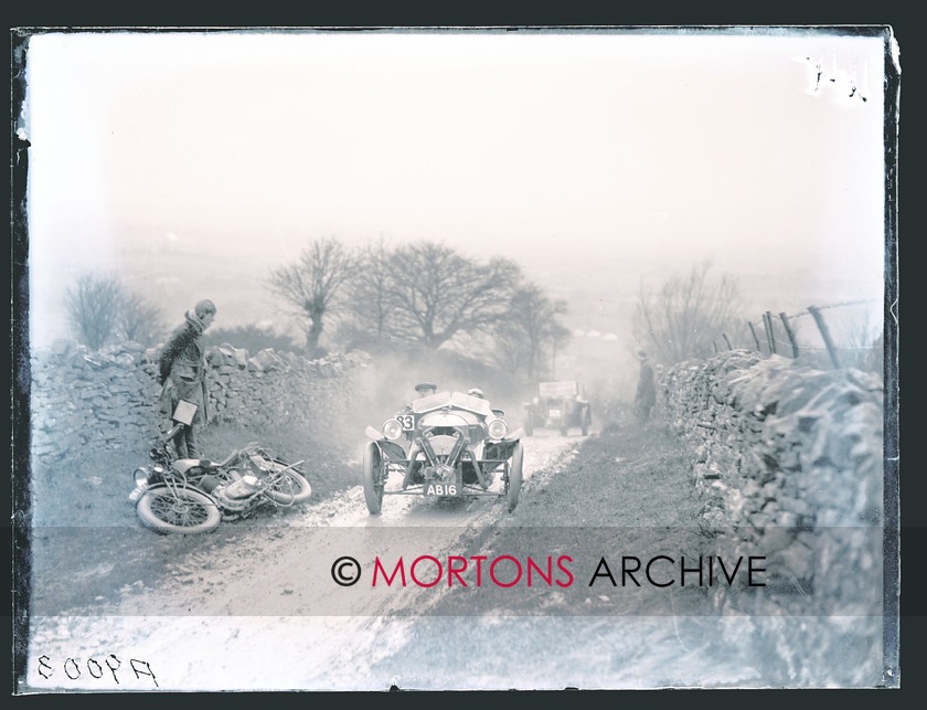 CARDIFF-LEICESTER 1928 04 
 H F S Morgan, restarting on Bushcombe Hill, having been baulked near the summit. Weyl watches, his HRD abandoned. 
 Keywords: 1928 Cardiff - Leicester - Cardiff trial, 2011, Mortons Archive, Mortons Media Group, November, Straight from the plate, The Classic MotorCycle