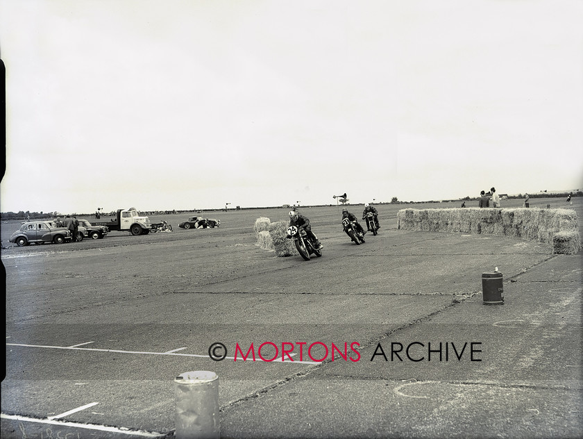 plate 1728 8 
 The sole Matchless twin - ridden be Osborne and Clarke - leads a group through the chicane. 
 Keywords: 1956, July 2011, Mortons Archive, Mortons Media Group, Straight from the plate, The Classic MotorCycle, Thruxton