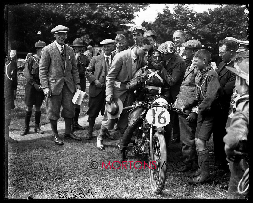 A6238 
 TT Junior/Lightweight 1926. Ghersi receives congratulations - although excluded from the results, he wasn't thrown out of the race, hence was allowed to keep his fastest lap. 
 Keywords: 1926, a6238, glass plate, isle of mann, junior, lightweight, Mortons Archive, Mortons Media Group Ltd, Straight from the plate, the classic motorcycle