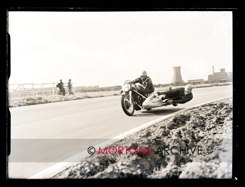062 Glass Plate 03 
 Aintree road racing September5 1954 - Pip Harris (Norton) displays spectacular-yet-controlled winning form during the sidecar scratch race. 
 Keywords: Glass plate, Mortons Archive, Mortons Media Group