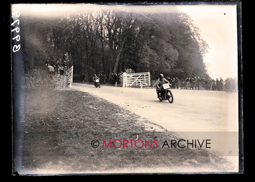 062 SFTP 5 
 Straight from the plate - Easter meeting Donington 1933 - One of the Nortons - Arthur Tyler, perhaps - passes through the (happily, open!) gate. 
 Keywords: 1933, Donington Park, Glass plate, Mortons Archive, Mortons Media Group, Straight from the plate