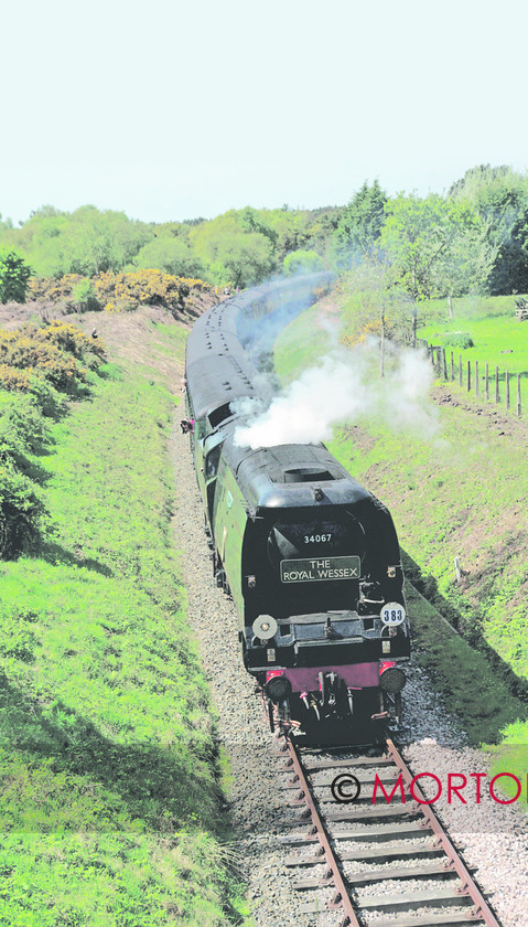 44 Swanage 
 SR unrebuilt Battle of Britain Pacific No 34067 Tangmere heads the 'Wessex Venturer' from Victoria over the main line link at Motala and on to the Swanage Railway. 
 Keywords: feature swanage, Heritage Railway, issue 124, Mortons Archive, Mortons Media Group, publication HR