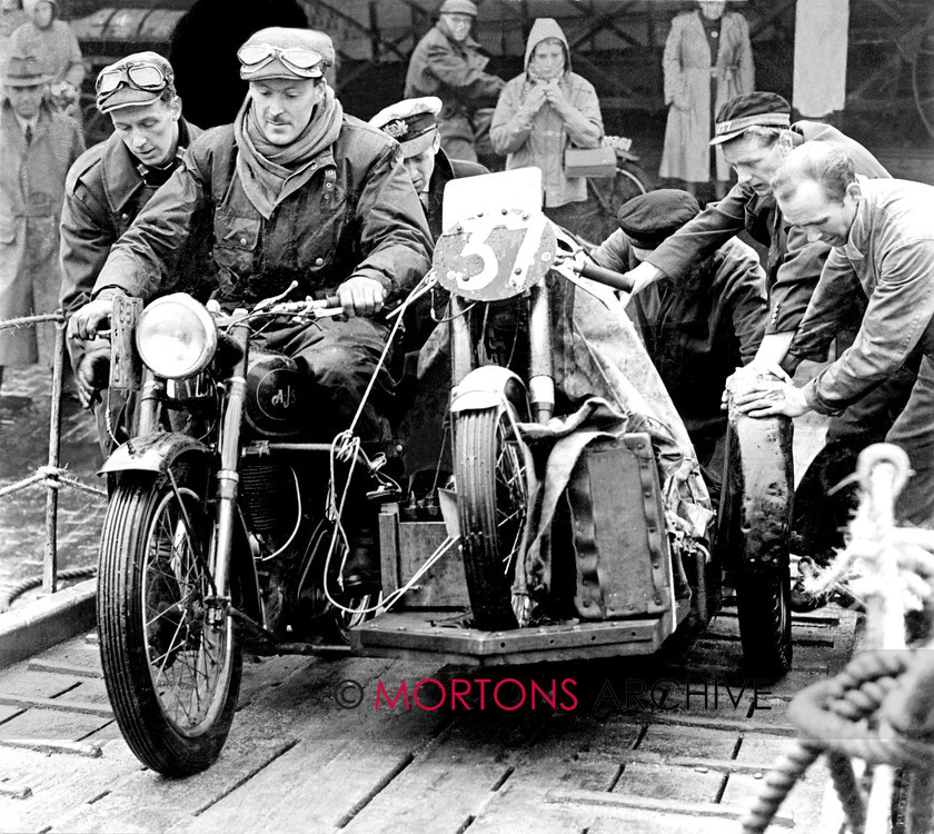 Manx 6C 
 6C – Owen Greenwood is helped ashore with his 1953 MGP mount strapped on the AJS sidecar. 
 Keywords: 2012, Exhibition of historic images, Manx Grand Prix, Mortons Archive, Mortons Media Group, Mountain Milestones - Memories from Mona's Isle