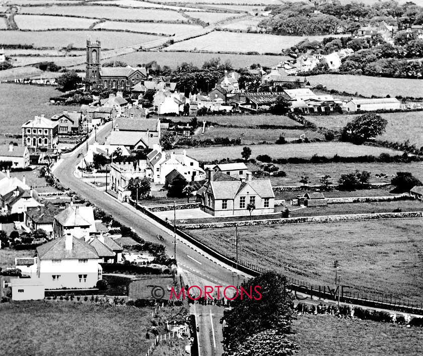Manx 20A 
 20A – A great shot of Douglas Road Corner, showing just why Kirk Michael is such a challenge. 
 Keywords: 2012, Exhibition of historic images, Manx Grand Prix, Mortons Archive, Mortons Media Group, Mountain Milestones - Memories from Mona's Isle