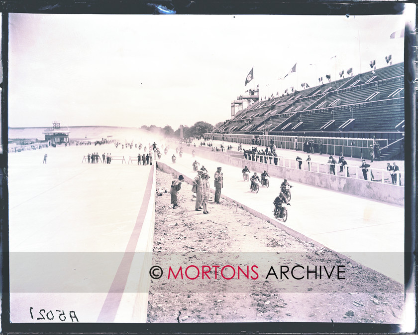 FRENCH GP 1925 03 
 The 1925 French Grand Prix - Riders steam past the disappointingly empty grandstands. 
 Keywords: Mortons Archive, Mortons Media Group, Sept 11, Straight from the plate, The Classic MotorCycle