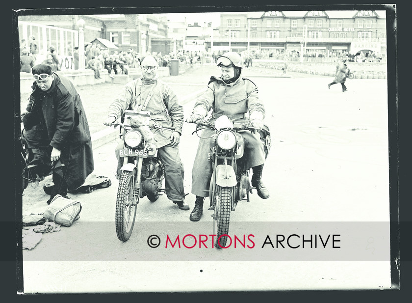 057 SFTP 06 
 J R Walton (BSA) displays a rather unfortunate rabbit on his numberplate adn Cpl W E Christian looks on 
 Keywords: 1954, ACU National Rally, Glass plate, Mortons Archive, Mortons Media Group Ltd, Straight from the plate, The Classic MotorCycle