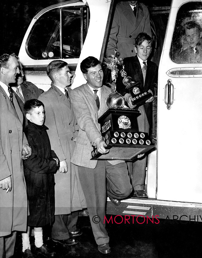 Manx cover 
 Cover shot - Different times. Jimmy Buchan arrives home in Perth with the spoils of his 1956 Manx Grand Prix victory. 
 Keywords: 2012, Exhibition of historic images, Manx Grand Prix, Mortons Archive, Mortons Media Group, Mountain Milestones - Memories from Mona's Isle