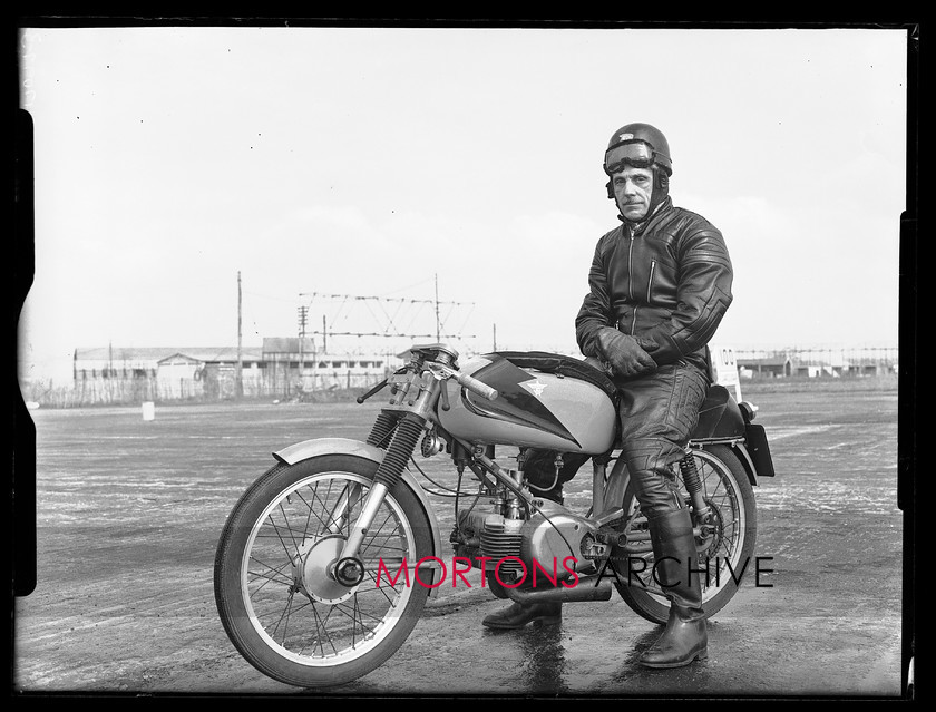17097-03 
 'Specials Day' at Silverstone 1956. Jim Bound's 125cc Rumi, a rare sight in 1956 Britain. 
 Keywords: 125, 125cc rurli, 17097-03, 1956, glass plate, j bound, Mortons Archive, Mortons Media, Mortons Media Group Ltd, rumi, silverstone, specials, Specials Silverstone 1956, Straight from the plate, tcm, the classic motorcycle