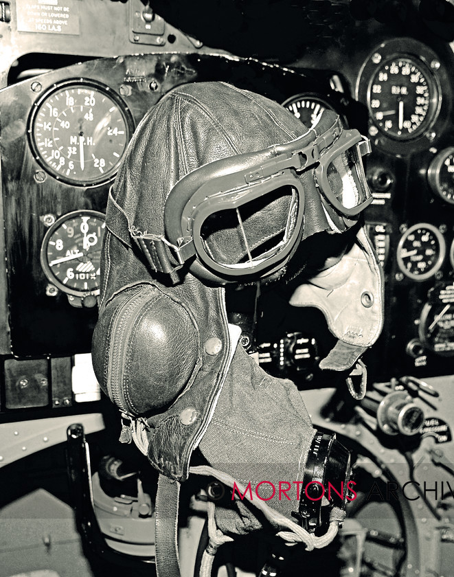 WD560563@91 cockpit 1-SEPIA 
 An early war Type B flying Helmet inside a 'Spit' 
 Keywords: Aviation Classics, copyright free, date ?, event ?, feature Cockpit, issue 3, Issue 3 Spitfire, make Supermarine, model Spitfire, Mortons Archive, Mortons Media Group, person(s) name ?, photographer Jarrod Cotter, place ?, publication Aviation, type Mk.II, year 1940