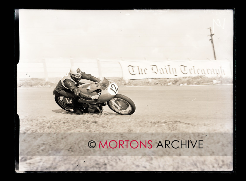 062 Glass Plate 02 
 Aintree road racing September5 1954 - The master stylist, world champion Geoff Duke (Gilera) at Anchor Crossing. 
 Keywords: Glass plate, Mortons Archive, Mortons Media Group