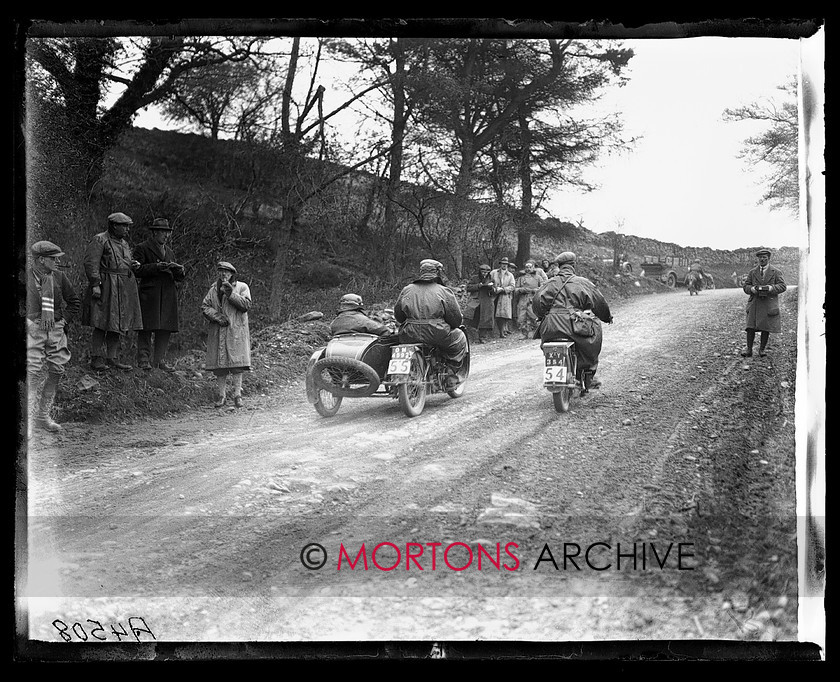A4508 
 P Pehrson (55, 490cc Dunelt s/car) is passed by FW Neill (54, 980cc Matchless). 1925 ACU Stock Machine Trial. 
 Keywords: 1925, a.c.u, A4508, ACU Stock Machine Trial, glass plate, October 2009, stock machine trial, The Classic Motorcycle, trial