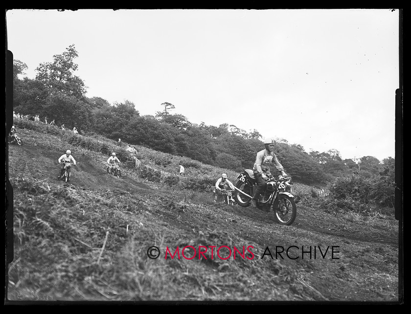 17308-05 
 "1956 British International Motocross GP" Tony White (26 Velocette) heads the pack. 
 Keywords: 17308-05, 1956, british international, british international motocross gp, glass plate, motocross, September 2009, Straight from the plate, The Classic MotorCycle