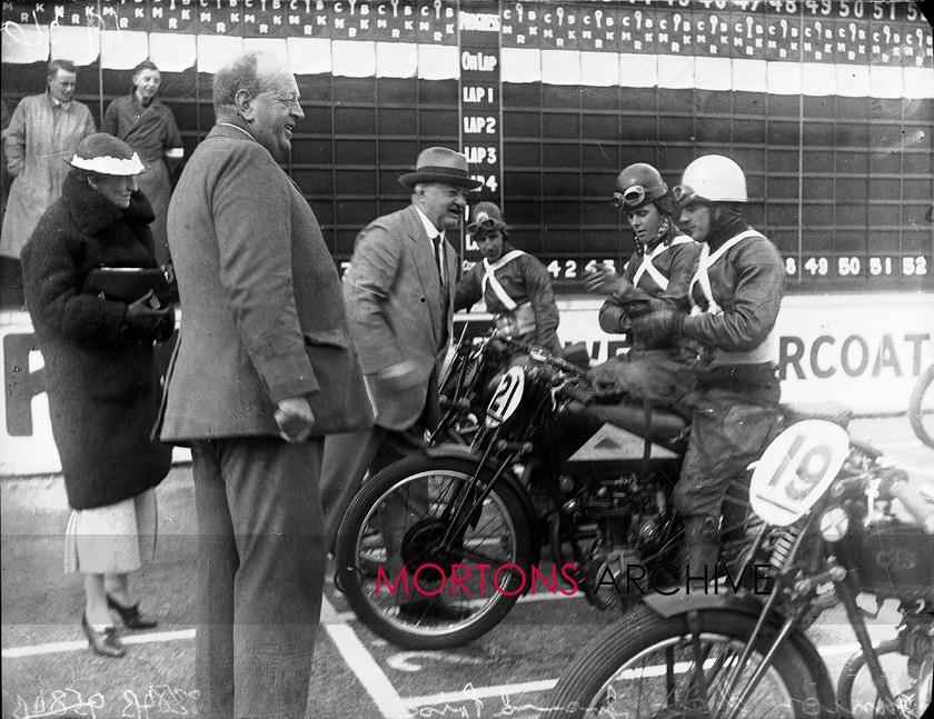 9384-14 
 1936 Junior and Lightweight Manx Grands Prix. His Excellency the Lieut-Governor of the IoM, Sir Montague Butler, tours the Lightweight starting grid. Number 21 is Dave Whitworth (Cotton). 
 Keywords: 1936, 9384-14, glass plate, isle of mann, January 2010, manx, manx junior grand prix, Mortons Archive, Mortons Media, Mortons Media Group Ltd., The Classic MotorCycle, tt