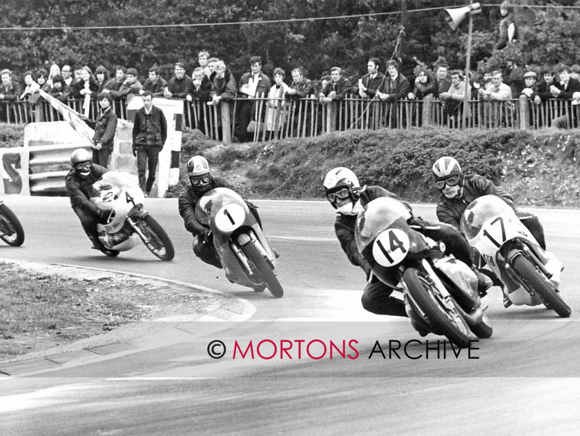 030 Martin Carney 07 
 Martin Carney, leading a quality field around the cement dust, at Druids on the 350 Kawasaki, Rex Butcher (17, Yamaha), Giacomo Agostini (MV) and Kel Carruthers (Yamaha) 
 Keywords: 2014, Classic Racer, July/August, Mortons Archive, Mortons Media Group Ltd, Racing