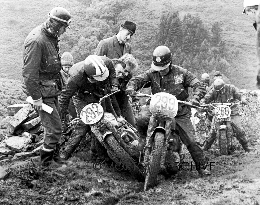 Nicholls-21 
 Industries Association man Hugh Palin watches the struggling competitors on the notorious Sky Hill section of the 1965 Manx ISDT. Arch enthusiast Geoff Duke was clerk of the course. 
 Keywords: July 04, Mortons, Mortons Archive, Mortons Media Group Ltd, Nick Nicholls, The Classic MotorCycle