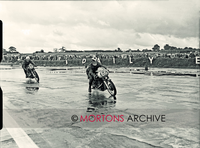 SFTP 1954 Hutchinson 100 07 
 1954 Hutchinson 100 held at a wet Silverstone - Arthur Wheeler (AJS) sticks out a leg to steady himsealf, he is been chased by Bob Rowbottom (AJS 350cc) 
 Keywords: 2016, April, Glass plate, Hutchison, Mortons Archive, Mortons Media Group Ltd, Straight from the plate, The Classic MotorCycle